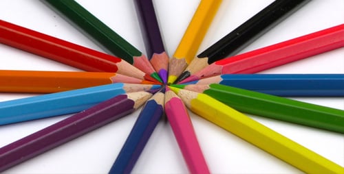 Colorful Pencils Arranged in a Circle on White