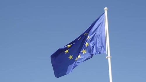 European Union Flag Waving Against Blue Sky