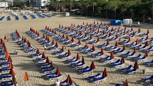 Empty sun loungers on the beach aerial view 4 K Turkey Alanya
