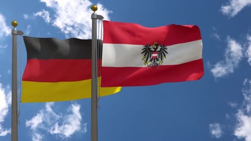 Germany and Austria National Flags Waving in Blue Sky