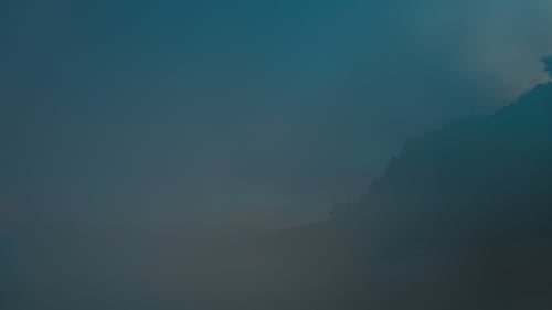 Misty Tropical Hillside at Sunrise