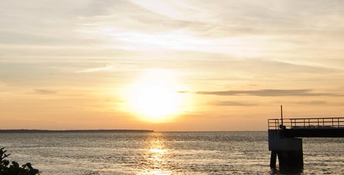 Golden Sunset Time-Lapse Over Tranquil Ocean Waters