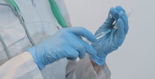 Doctor Gaining a Syringe Medicine