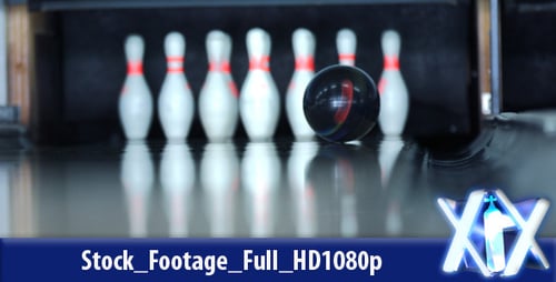 Bowling Ball Strikes Pins in Bowling Alley