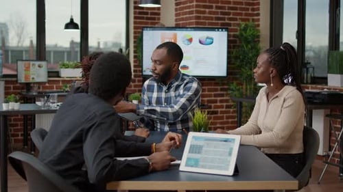 Colleagues Collaborate in Modern Office Setting