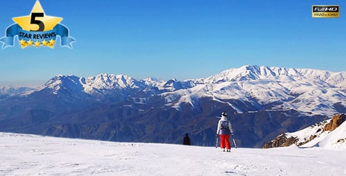 Skiers on Sunny Snowy Mountain Top