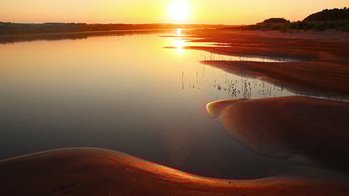 Beautiful Orange Sunset With Wave River Sand Beach