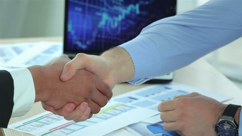 Close Up Of Businessmen Shaking Hands