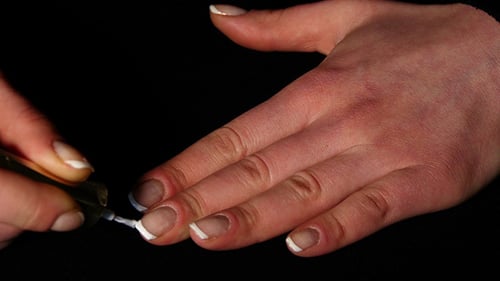 Woman Hands And Nails With French Manicure