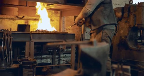 Blacksmith Works at Fiery Forge in Indoor Workshop