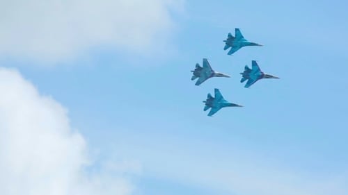 Military Jets Performing Aerobatics in Blue Sky