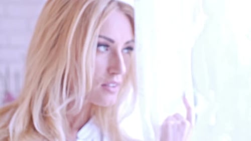 Adult Blond Woman Posing By the Window