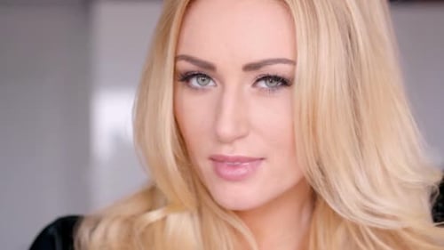 Blonde Woman with Makeup Looking at Camera