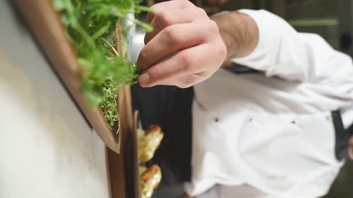 Chef Garnishing Bread with Fresh Herbs