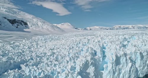 Slow Motion Calving Glacier of Snow Antarctica Continent Aerial