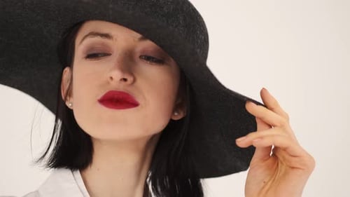 Model in Trendy Clothes Changes Her Poses in the Studio