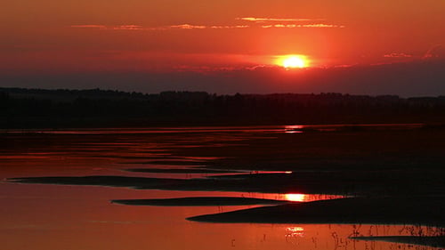 Beautiful Orange Sunset With Wave River Sand Beach