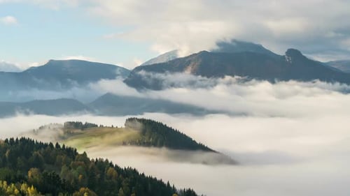 Foggy Morning with Wave of Mist Clouds in Mountains Valley Nature