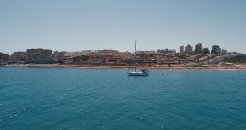 Drone Flies Above Mediterranean Sea and Around the Sailing Yacht at Summer Day