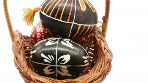 Decorated Easter Eggs in a Woven Basket
