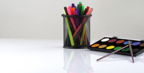 Stationary Shot of Watercolor Paints and Markers