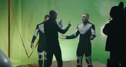 Actors and Director Filming on Green Screen Set
