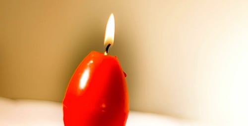 Red Easter Egg Shape Candle Burning