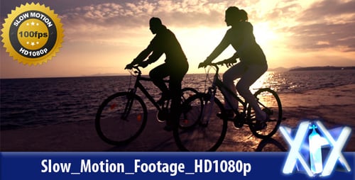 Couple Biking by Ocean at Sunrise