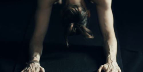 Man Does Yoga Stretching and Balancing Exercise