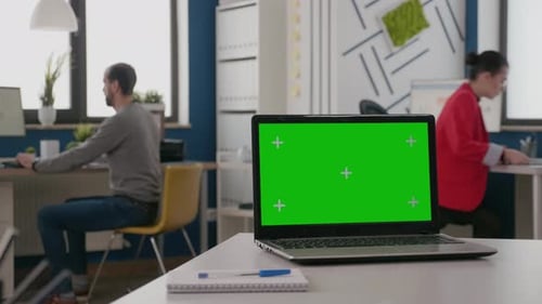 Close Up of Isolated Green Screen on Laptop at Empty Desk
