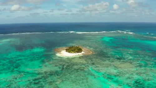Tropical Guyam Island with a Sandy Beach and Tourists.