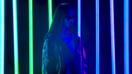 Stylish Woman Posing With Neon Lights