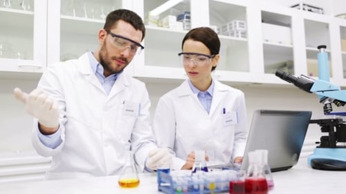 Young Scientists Making Test Or Research In Lab