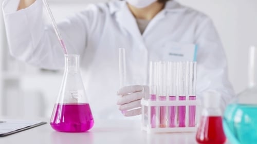 Female Scientist Performing Experiment in Laboratory