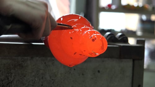 Glass Blower Shaping Molten Glass Close Up