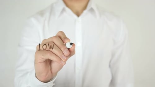 Man Writes Low Interest Rates on Glass