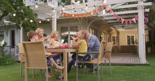 Family Gathering Outdoors for Birthday Celebration