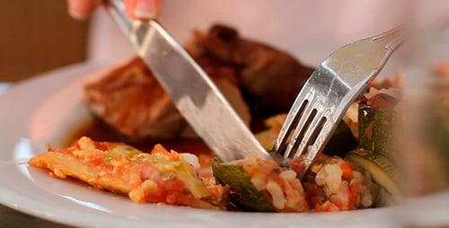 Girl Eats a Dish of Vegetables