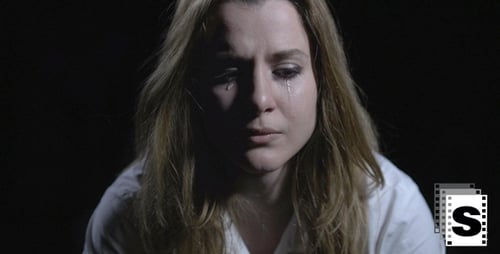 Woman Crying with Tears Streaming Down Face