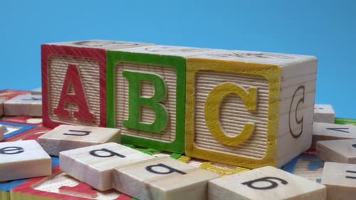 ABC wood block rotate on table.