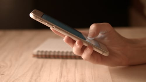 Close Up of Hand Using Smart Phone