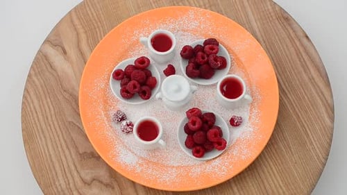 Overhead of Raspberries, Juice and Powdered Sugar