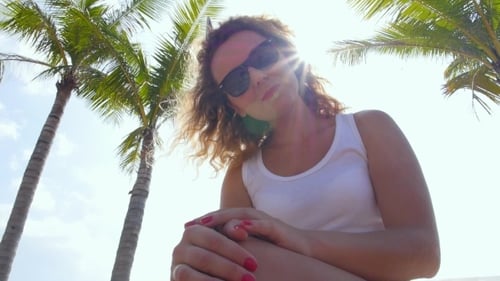 Young Pretty Female In Stylish Sunglasses Against