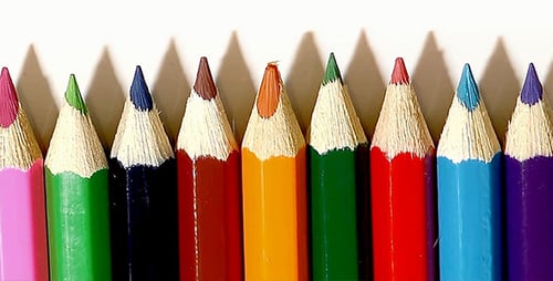 Row of Sharpened Colorful Pencils on White