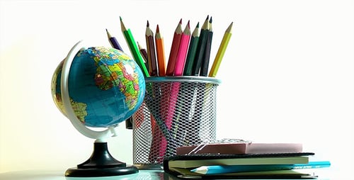 School Globe with Colorful Pencils and Notebooks
