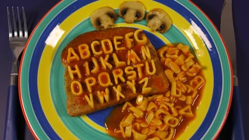 Alphabet Pasta Forming Letters on Toast With Sauce