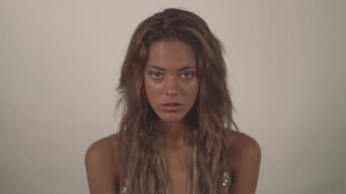 Young Woman Portrait with Long Wavy Brown Hair