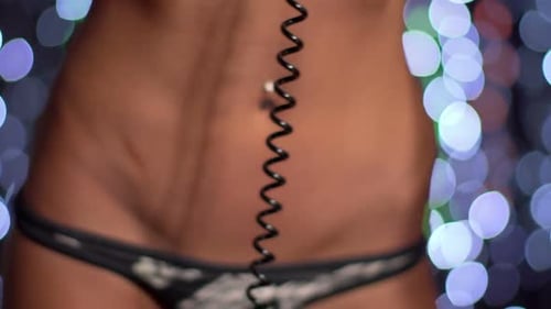 Woman Wearing Headphones in Front of Lights