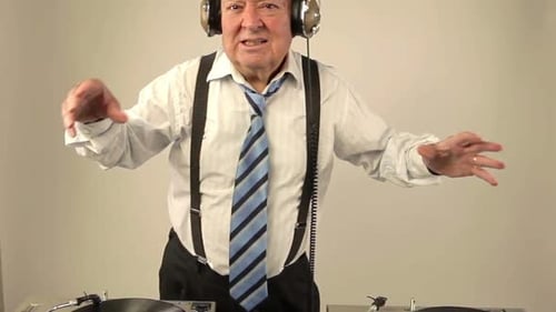 Senior Man Enjoying Music at the Turntables