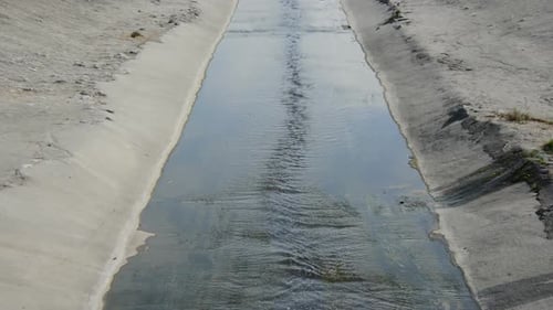 Water Flowing Through Concrete Urban Canal